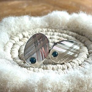 Vintage cuff links with blue cabochon stone.